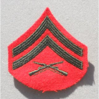 Corporal USMC Rank Insignia subdued on sand, used