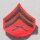 Corporal USMC Rank Insignia subdued on sand, used