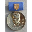 Arthur-Becker-Medal of the FDJ, gold 12d, 1985-89, Iron, Brass plated, with Ribbon Bar